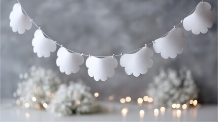 Cloud-shaped garland with fairy lights and baby's breath against gray background