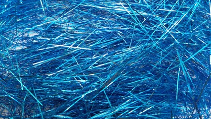 Stop motion Blue foil tinsel background, Shimmer shiny blue tinsel shred festive, wedding, birthday party, Christmas decorations