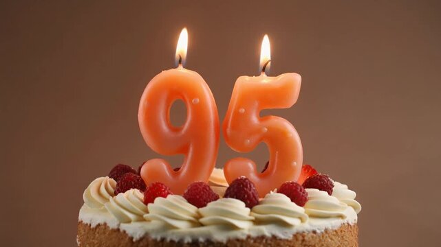 Decorated cake with candle in number 95. Video for birthday or anniversary party and celebration