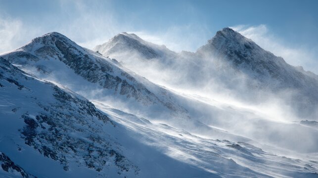 Snowy mountain peaks shrouded in windblown snow under a bright blue sky winter - Powered by Adobe
