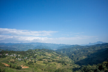 Obraz premium Mountain Valley and Terraced Fields View on the Ha Giang Loop, Vietnam