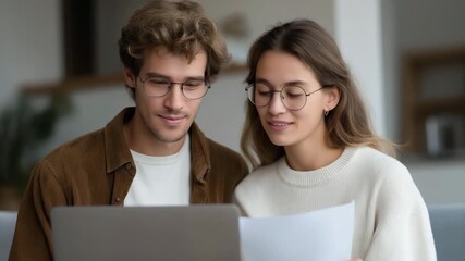 Young couple reviewing monthly income and expenses on a laptop while taking notes, symbolizing budget planning, financial communication, shared responsibility, and planning for long-term savings. - Powered by Adobe