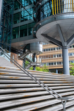 Architecture with stairs and staircase exposes structure where geometry and design dominate, relying on minimalism to sharpen architectural detail set against urban space and modern building
