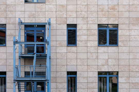 Minimalism in architecture focuses on stairs and staircase within a structure where geometry and design align, highlighting architectural detail in dense urban space and modern building