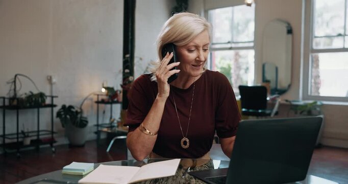 Mature woman, phone call and happy at salon with booking, appointment or notebook for grooming service. Person, hairdresser and smartphone with discussion, smile and contact with schedule at shop