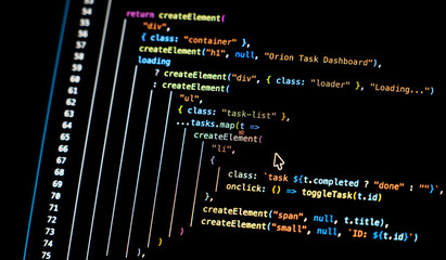 Real-time generated written computer source code in closeup shot on monitor - white letters running on black background - concept of digitization, science, research and course of a program script