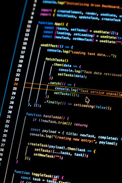 Real-time generated written computer source code in closeup shot on monitor - white letters running on black background - concept of digitization, science, research and course of a program script