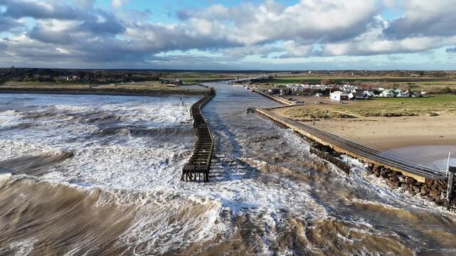 Stormy seas Southwold Harbour mooring in Suffolk UK drone,aerial