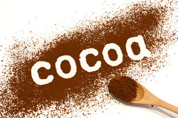 Cocoa word written on scattered cocoa powder background