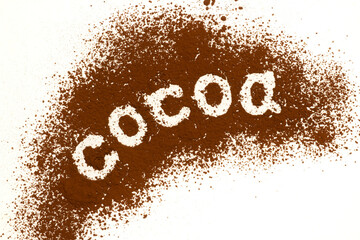 Cocoa word written on scattered cocoa powder background