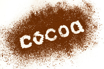 Cocoa word written on scattered cocoa powder background