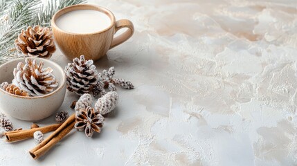 A warm beverage in a wooden cup, surrounded by frosted pine cones, cinnamon sticks, and star anise on a textured, neutral background. Soft, diffused lighting.