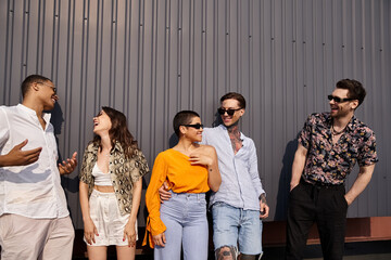Young friends enjoying a lively rooftop party under the warm sun