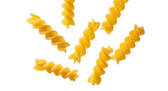 Falling raw Fusilli, Rotini, uncooked Italian Pasta, isolated on white background, full depth of field