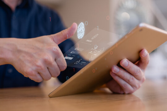 person using biometric fingerprint scan on a tablet with futuristic digital interface, representing data protection, identity verification, cybersecurity secure mobile access technology.