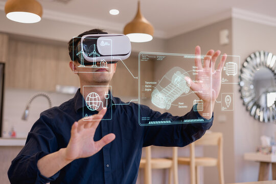 man using virtual reality headset interacting with futuristic hologram interface showing electric vehicle technology, representing innovation, engineering, AR/VR, smart industry, and digital design. - Powered by Adobe