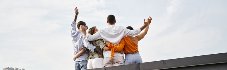 Friends enjoying a joyful rooftop party with laughter and good vibes together in the afternoon
