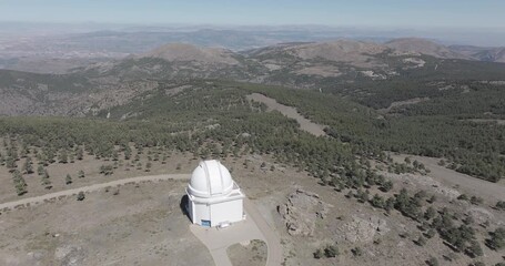Aerial drone shot towards Calar Alto Observatory in the Sierra de Los Filabres mountain range in Almeria, Andalusia, Spain. Largest astronomical observatory in Europe. Shot in ProRes 422 HQ