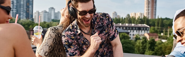 Young friends celebrate together on a rooftop party filled with laughter and music