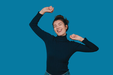 content and tranquil woman standing, an effortlessly joyful and peacefully relaxed woman in calm setting