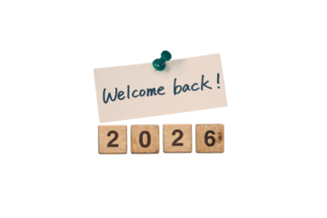 Welcome Back 2026 Note Pinned Above Wooden Number Blocks