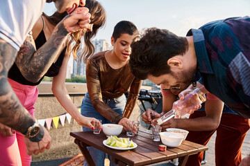 Young friends celebrate summer together at a rooftop party filled with laughter and fun