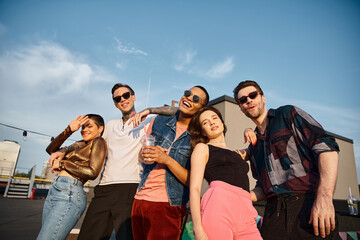 Young friends celebrate friendship with a vibrant rooftop party under a clear sky