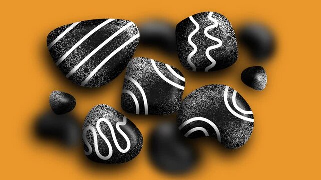 Black stones decorated with white dynamic curved patterns