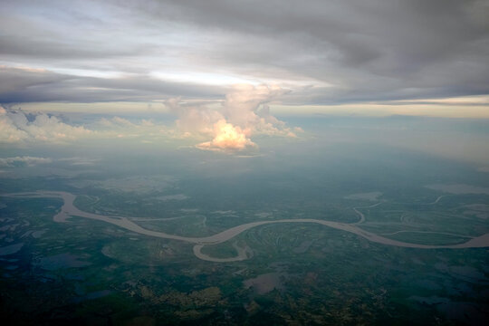 amazon river aerial view from airplane window at sunset