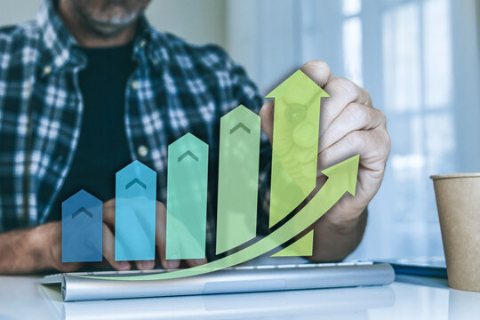 Man analyzing business growth and financial profit on a futuristic virtual chart