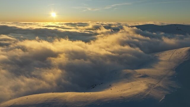 Broad sky sea, Vast dawn illuminated vapor, Expansive sky over glowing misty mountains, Colossal cloudscape dawn bathed with shimmering golden mist over distant snowy crests