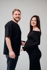 Expecting parents share joy during maternity photo session