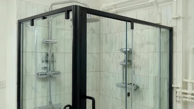 Architectural 4K close up of a simple glass shower enclosure featuring intricate white fluted tile on the walls showcasing a modern bathroom design perfect for hygiene and refreshing at home interior