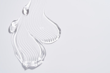 Gel texture swoosh swatch sample cosmetics. Cosmetic gel product with bubbles close up. facial jelly serum, cleanser, shower gel or shampoo