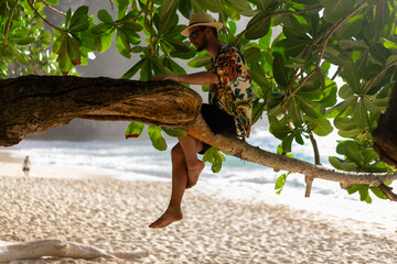 Man laying on tree., nusa penida, bali. High quality photo