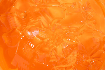 Purifying orange gel macro background texture Product for cosmetology and dermatology