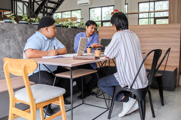 Dynamic team brainstorming innovative ideas in a bright, modern workspace