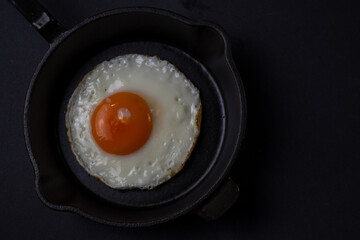 single fried egg in a pan