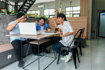 Fototapeta premium Energetic Team Celebrates Project Success With High Fives And Laughter Around Modern Office Table