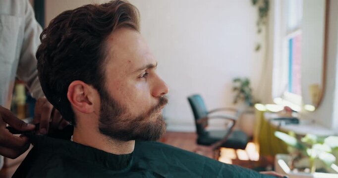 Barbershop, hands and man with barber, haircut or consultation for hair maintenance, bib and process. Salon, hairdresser and people with cape for hairstyle, haircare and appointment with client
