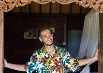 Man smiling indoors, starting the day with a smile. High quality photo