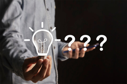 Problem solving concept,creative brainstorming,focus and find a solution. Question mark and light bulb symbolize innovation,thinking and finding answers.