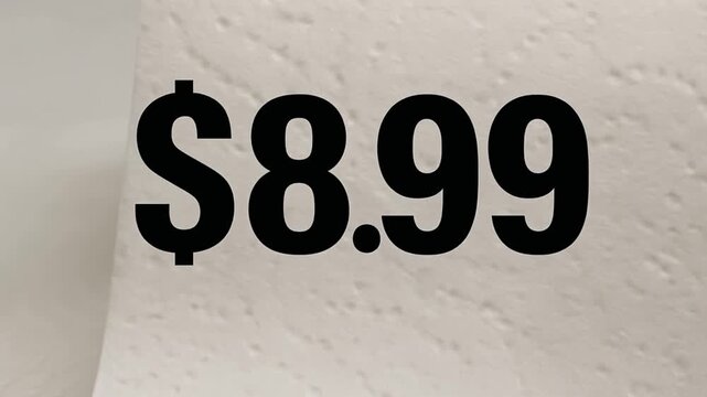 cost living groceries concept. Roll of paper towels with a price tag of $8.99 displayed prominently.