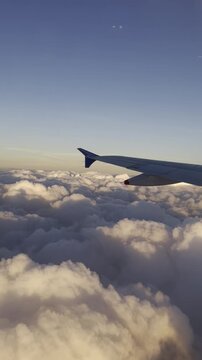 Aerial View from Airplane Window Flying Over Clouds to Flores, Guatemala