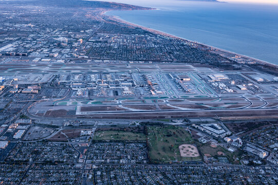 Aerial Panorama of Los Angeles International Airport LAX and Surrounding Urban Coastline at Sunrise