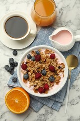 Tasty breakfast. Granola with yogurt and fruits served on white marble table, flat lay