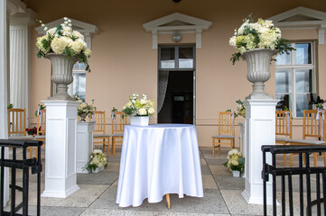 Wedding Ceremony Table with Floral Columns in Latvia