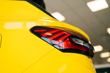 Taillight of a yellow car