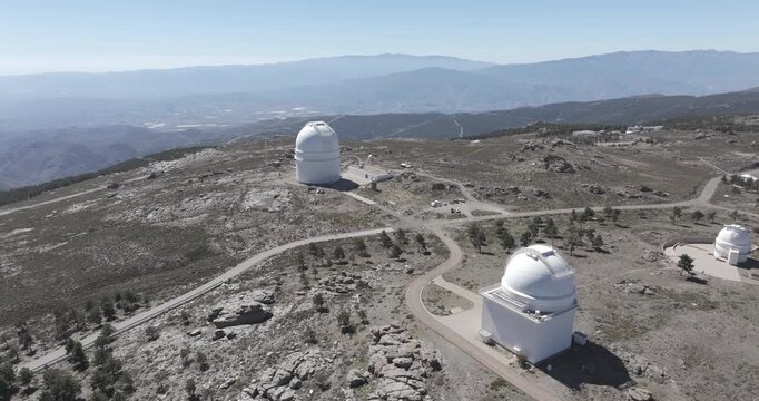 Aerial drone shot towards Calar Alto Observatory in the Sierra de Los Filabres mountain range in Almeria, Andalusia, Spain. Largest astronomical observatory in Europe. Shot in ProRes 422 HQ