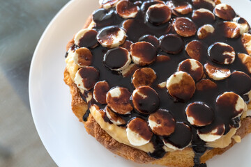 Boston cream pie with banana and chokolate. Traditional american cake. Ready to eat. Homemade